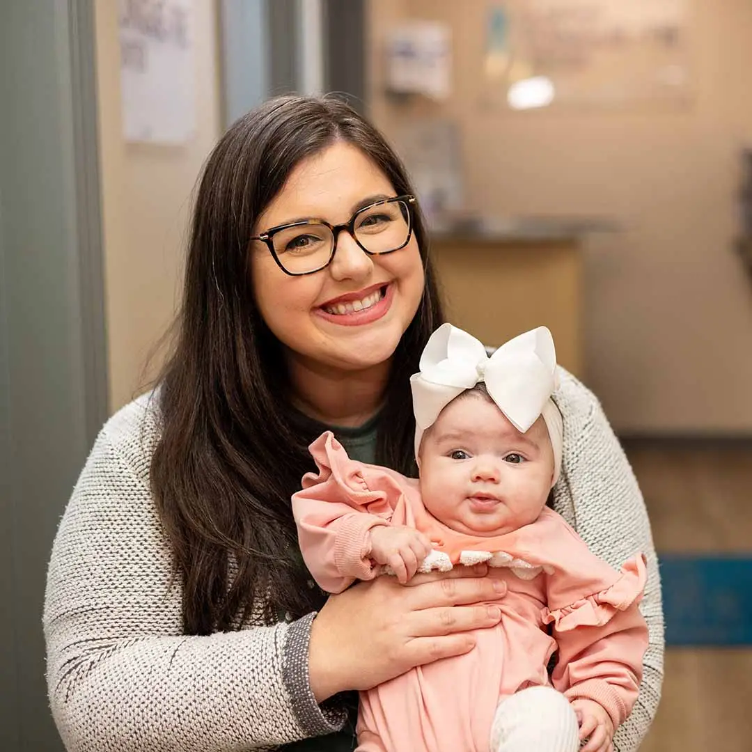 tongue-tie-education-support-tongue-tie-academy-Thank-you Mom holding a baby in her arms at the tongue tie center